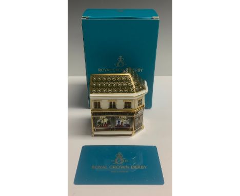 A Royal Crown Derby miniature model, The Royal Book Shop, celebrating the Platinum Wedding Anniversary of H. M. Queen Elizabe