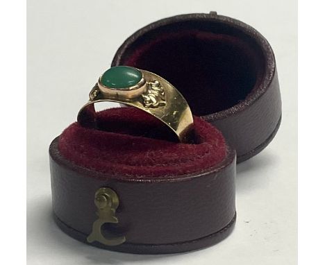 A 14ct gold ring, set with a single polished oval jade cabochon, size N, 2.6g, boxed 