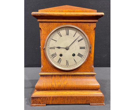 A late 19th century oak mantel clock, Lenzkirch movement, Roman numerals on silvered dial, twin winding holes, 36cm high 