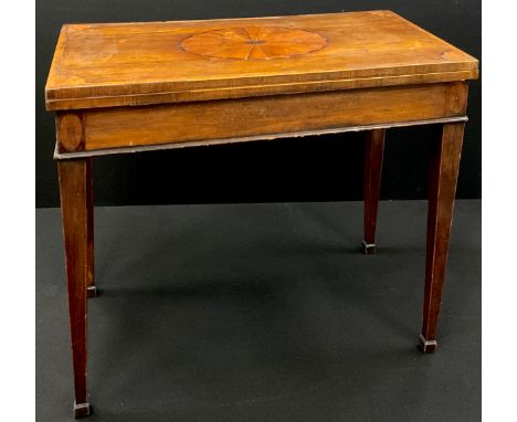A 19th century mahogany card table, hinged top inlaid with an oval batwing patera and enclosing a baize lined playing surface
