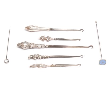 An Edwardian novelty glove hook, the terminal as Mr Punch, Birmingham 1907; others similar, Jester, pheasant claw, orchid pat