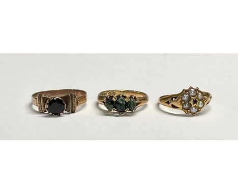 A 19th century 15ct gold flowerhead ring, set with seed pearls and garnet, size N, marked 625, 2.3g; a 19th century continent