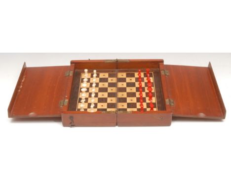 An early 20th century mahogany travelling chess board, 20.5cm wide 