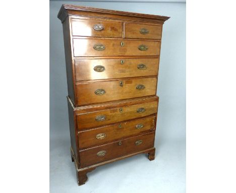 George III mahogany chest on chest, the upper section with a moulded cornice above an arrangement of two short and three long