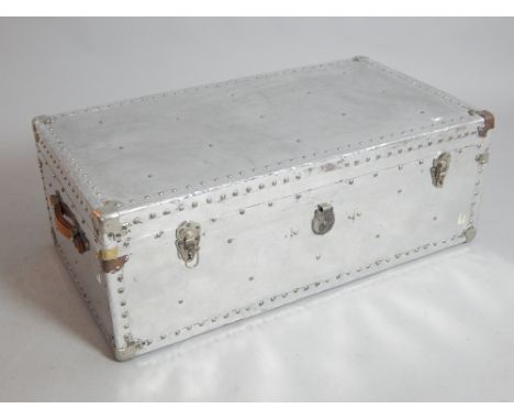 Vintage style polished aluminium rectangular trunk with tan leather strap handles, 91 cm W 