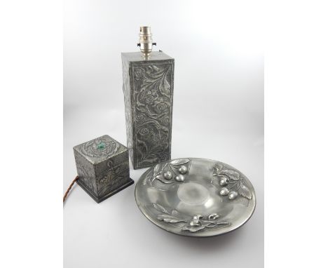 A selection of three white metal Art Nouveau items comprising a square section tea caddy, lamp base and a cherry dish. (3)