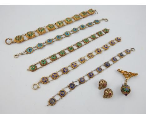 Roundel enamel decorated bracelets and earrings, and an enamel egg brooch. (7) 