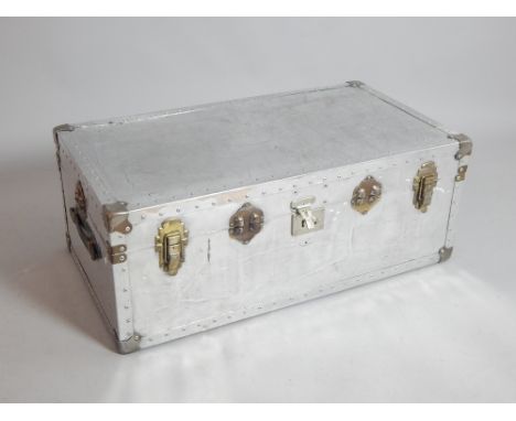Vintage style polished aluminium rectangular trunk with tan leather strap handles, 91 cm W 