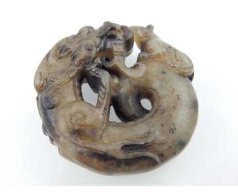 Chinese jade pendant, coiled dragon nose to nose with a rat, 5cm dia. 