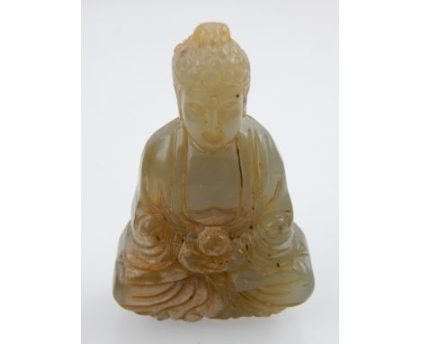 Chinese jade carving, study of a Buddha, sat in lotus position holding a peach. 