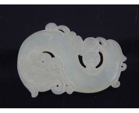 Chinese white jade pendant of a coiled dragon, 5.4cm l. 