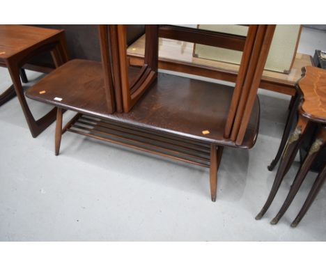 A mid century dark stained low coffee table by Ercol, approx dimensions 104cm x 45cm
Slight age related scuffs and wear in pa