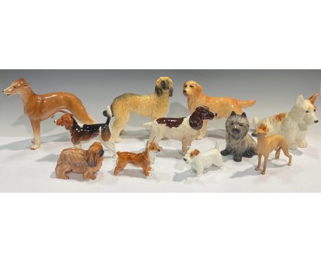 A Beswick model, of a Beagle, Wendover Billy, 13cm high; another, Spaniel, Horseshoe Primula, boxed; a seated Terrier; a Grey