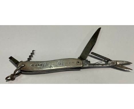 A Victorian silver multi-tool pocket knife, with corkscrew, penknife, scissors and other utensils, Chester 1897 