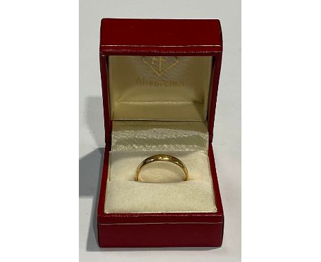 A 22ct gold wedding band, size R, marked 22ct, 3.6g, boxed 