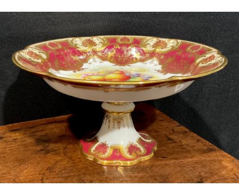A Royal Worcester shaped pedestal comport, painted by R. Lewis, signed, with ripening fruit within fancy gilt cartouche, the 