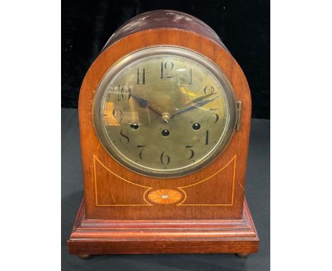 A late 19th/early 20th century mahogany dome top mantel clock, circular brass dial inscribed with Arabic numerals, eight day 