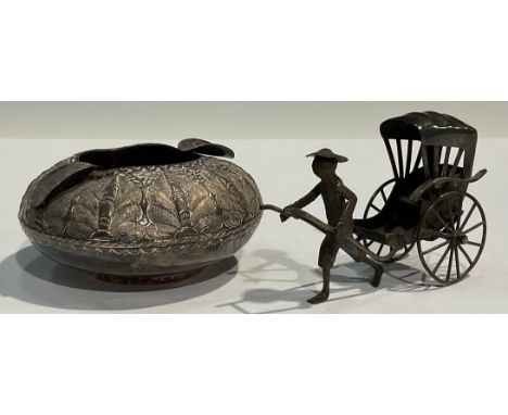 A Chinese low grade silver ashtray; a Chinese miniature model rickshaw (2) 