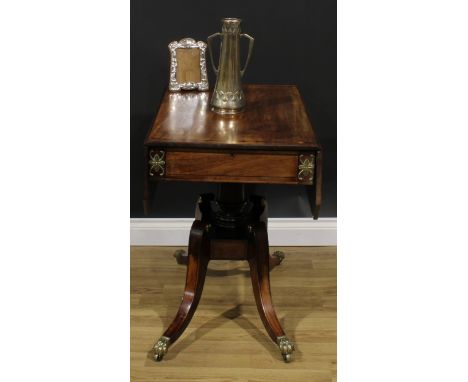 A Regency gilt metal mounted mahogany Pembroke table, rosewood banded canted rectangular top with fall leaves, drawer to frie