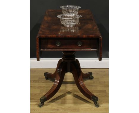 A George IV mahogany Pembroke table, of unusually long proportions, rounded rectangular top with fall leaves above a single f