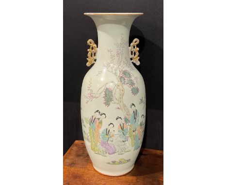 A large Chinese two handled ovoid vase, painted in polychrome with ladies of the court, script to verso, gilded scroll handle