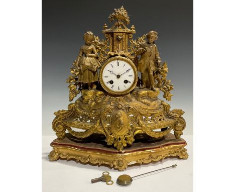 A 19th century French gilt spelter figural mantel clock, on shaped gilt wood base 