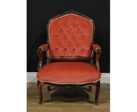 A Victorian rosewood button back nursing armchair, 88cm high, 65cm wide, the seat 53cm wide and 51cm deep 