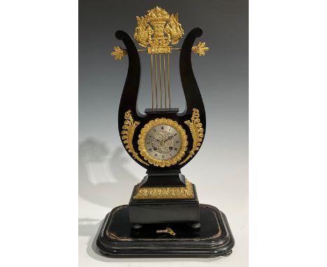 A Louis XVI Revival gilt metal mounted ebonised lyre-shaped table clock, 8.5cm silvered dial inscribed with Roman numerals, t