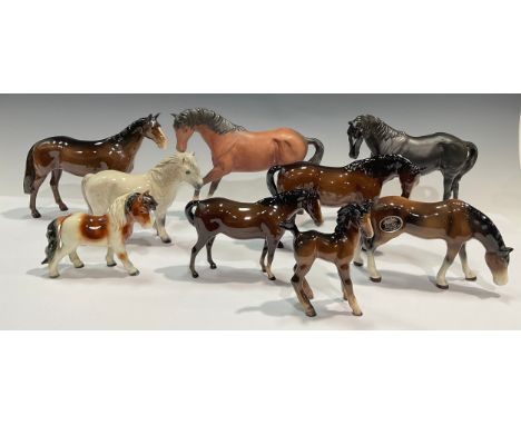 A Beswick model, of a horse, Black Beauty, matte glaze, 18cm high; another, brown; a Beswick model, of a Huntsman's Horse; a 