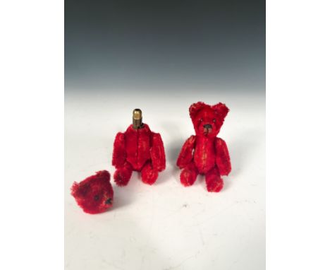 A Schuco compact bear, early 20th century, worked in red mohair, the removable swivel head and body open to reveal mirror and