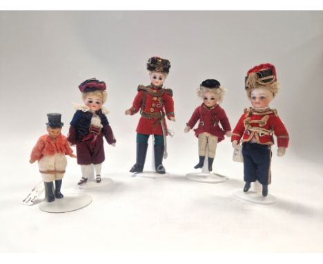 A group of male miniature bisque dolls, late 19th century, to include an all bisque boy inset with fixed cobalt eyes, painted