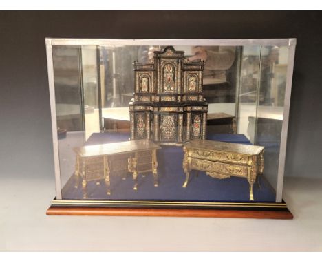 A group of modern cased model furniture pieces by Ian Glasspool, in glass mirror backed case, displaying 'boulle' furniture i