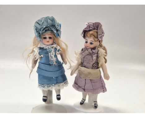 Two all bisque mignonette dolls, early 20th century, possibly by Simon &amp; Halbig, each inset with fixed blue glass eyes, w