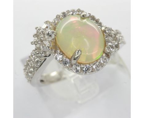 925 silver ring set with cubic zirconia and a central opal, size L, 3.6g. UK P&amp;P Group 0 (£6+VAT for the first lot and £1