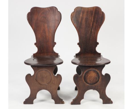 PAIR OF NINETEENTH CENTURY MAHOGANY HALL CHAIRS IN THE EARLY GEORGIAN STYLE, each with one piece fan shaped back, solid bow f