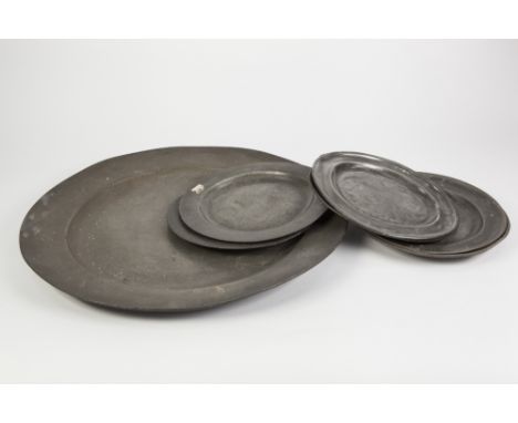 ANTIQUE PEWTER CHARGER WITH LONDON TOUCH MARKS, 18" (45.7cm) diameter, marks worn, TOGETHER WITH SIX SIMILAR PLATES, 9" (22.8