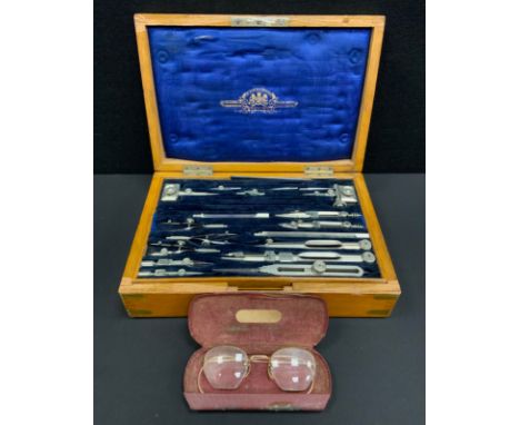 An early 20th century Stanley draughtsman's drawing implement's set, with assorted tools, adjustable angle rule etc, brass bo