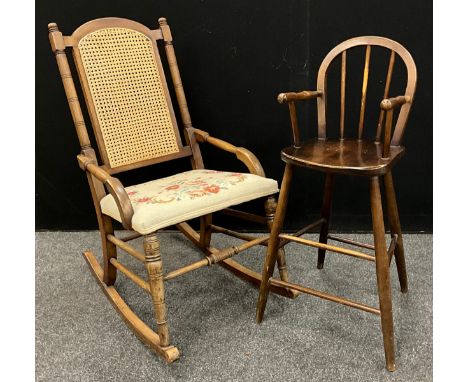 An Edwardian walnut rocking chair, with bergere split cane weave back, and tapestry upholstered seat;  an early 20th century 