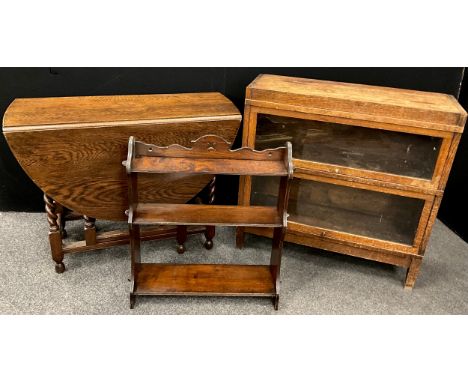 A mid 20th century oak Globe Wernicke style two tier sectional bookcase;  an elm wall shelf;  oak drop-leaf Dining table, (3)