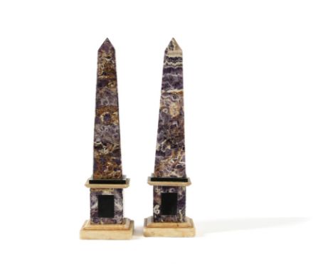 A pair of amethyst quartz veneered and marble mounted obelisks, 20th century, of square section and tapering form, the plinth
