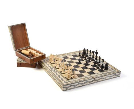 Y A fine Vizagapatam ivory, horn, ebony and sandalwood folding games board, early 19th century, the chequerboard exterior wit