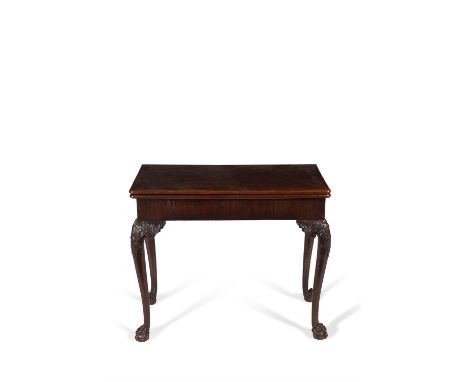 A George II mahogany folding card table, circa 1750, the hinged rectangular top opening to baize inset playing surface, above