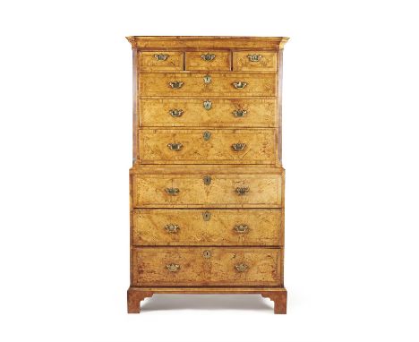 A George II walnut, burr walnut and feather banded secretaire chest on chest, circa 1740, the cavetto moulded cornice above t