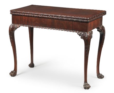 A George II mahogany concertina action card table, circa 1755, the hinged rectangular top with floral moulded edge, opening t