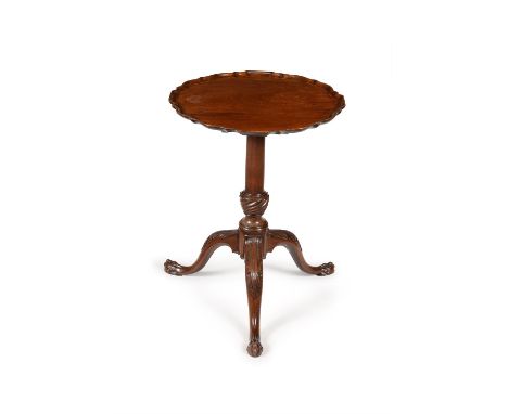 A George III mahogany tripod table, circa 1770, the hinged circular 'pie crust' top, above the turned tapering stem incorpora