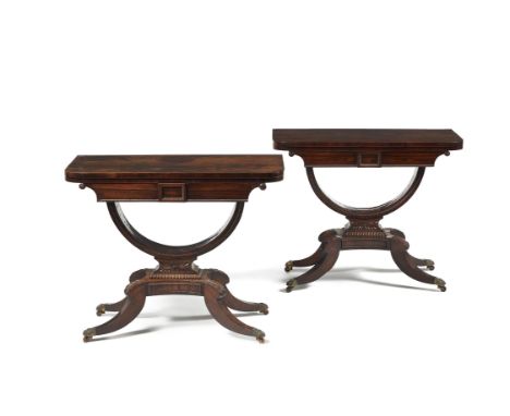 Y A pair of Regency rosewood card tables, circa 1825, in the manner of William Trotter, each hinged rectangular top rotating 