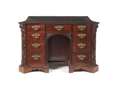 A George II mahogany serpentine kneehole desk, circa 1755, in the manner of Paul Saunders, the shaped top with leather inset 