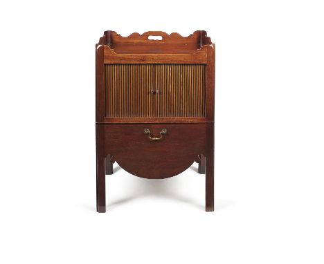 A George III mahogany night commode, circa 1780, the rectangular top with shaped three quarter gallery incorporating pierced 