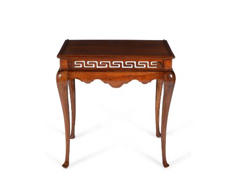 A Chinese hardwood console table, second half 18th century, the rectangular top with moulded edge, above scroll pierced friez