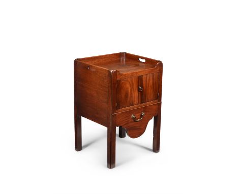 A George III mahogany night commode, circa 1780, the galleried top incorporating a pair of pierced handles, the pair of hinge